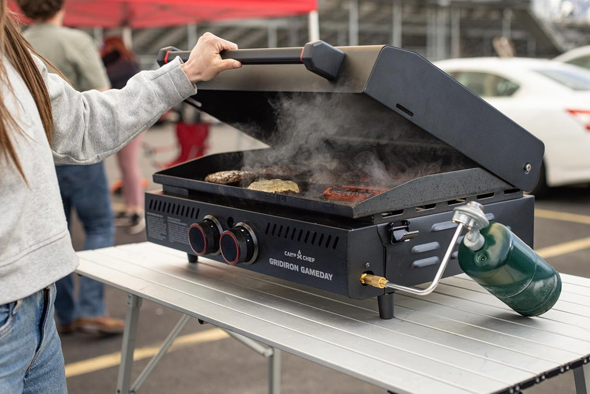 Gridiron Gameday 24" Flat Top Grill – Portable Tabletop Griddle with Hinged Lid, 24,000 BTUs, Flamethrower Ignition, Dual Heat Zones & Adjustable Legs for Tailgating, Camping, Outdoor Cooking