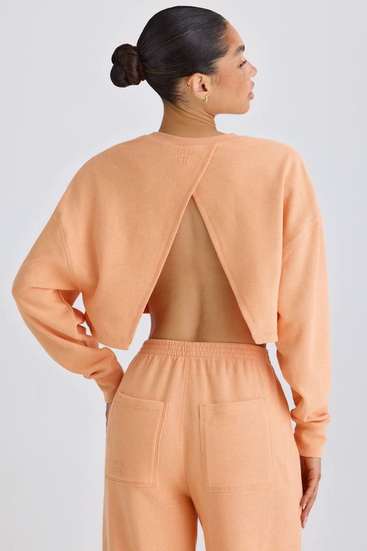 Textured Cotton Jersey Open-Back Cropped Sweatshirt in Peach