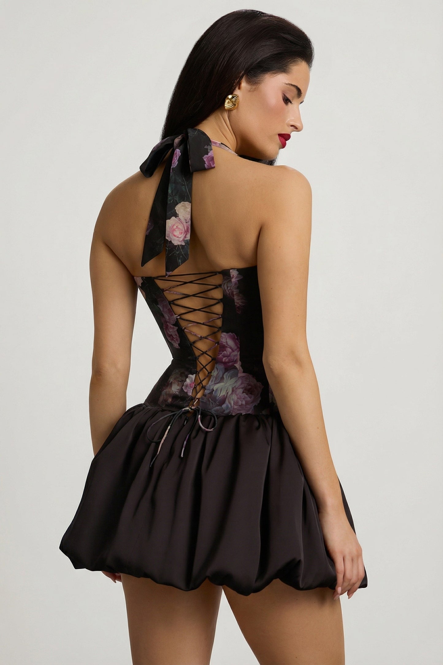 Halterneck Lace-Up Bubble Hem Mini Dress in Black Floral Print
