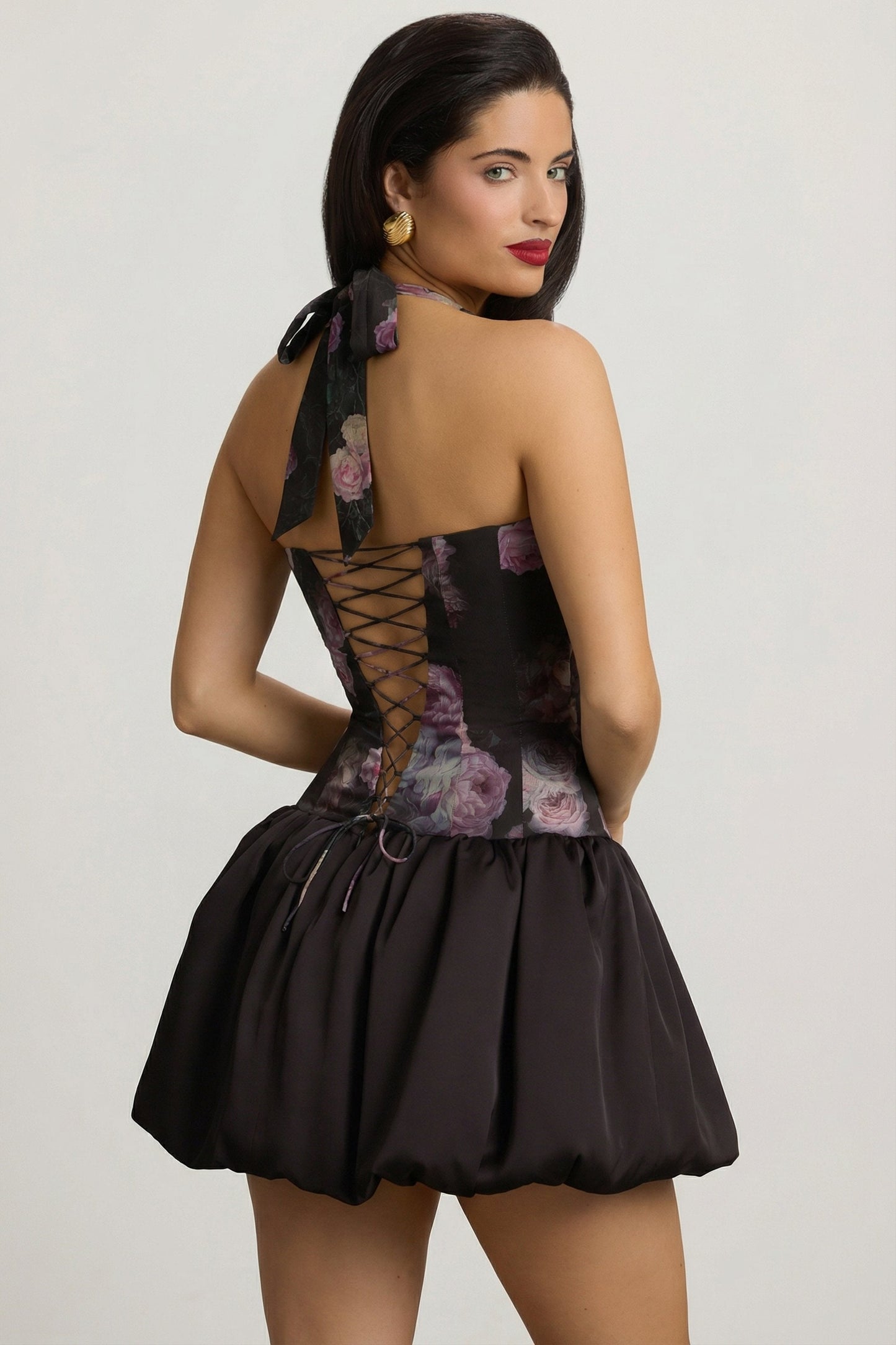 Halterneck Lace-Up Bubble Hem Mini Dress in Black Floral Print